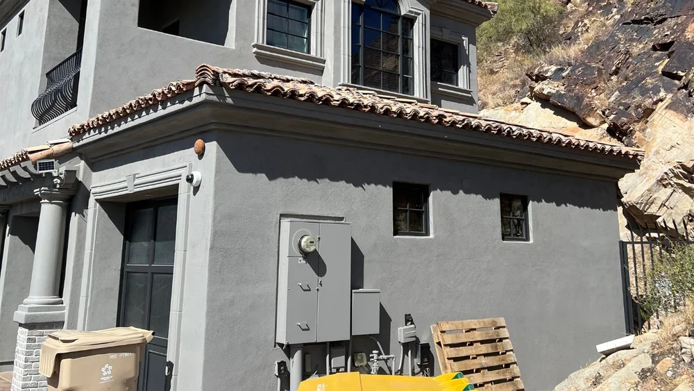 Commercial exterior repaint on a hillside building — Pioneer Paint Pros